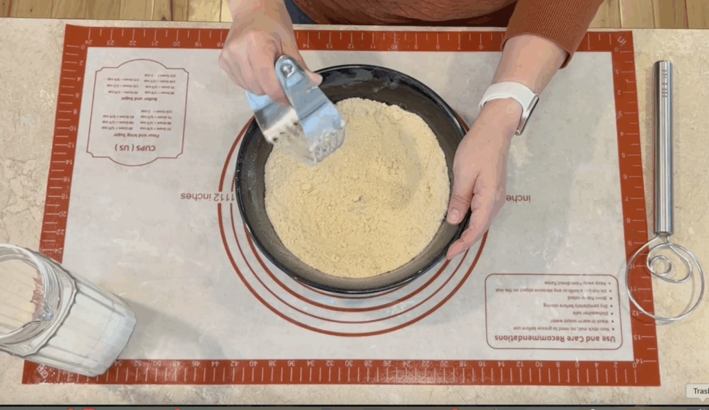 Mixing fresh milled flour biscuits with pastry blender.