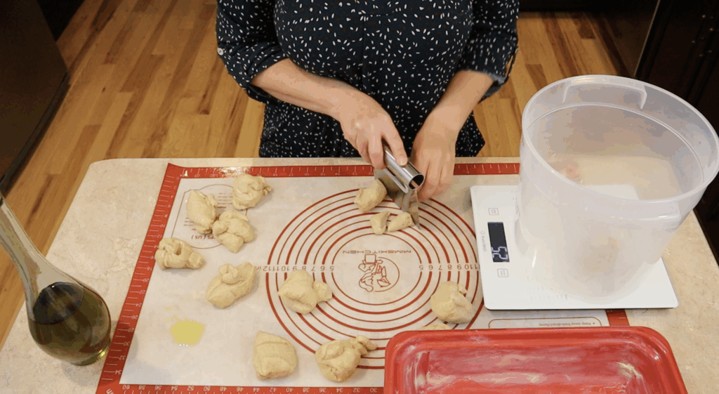 Dividing yeast rolls made with fresh milled flour.