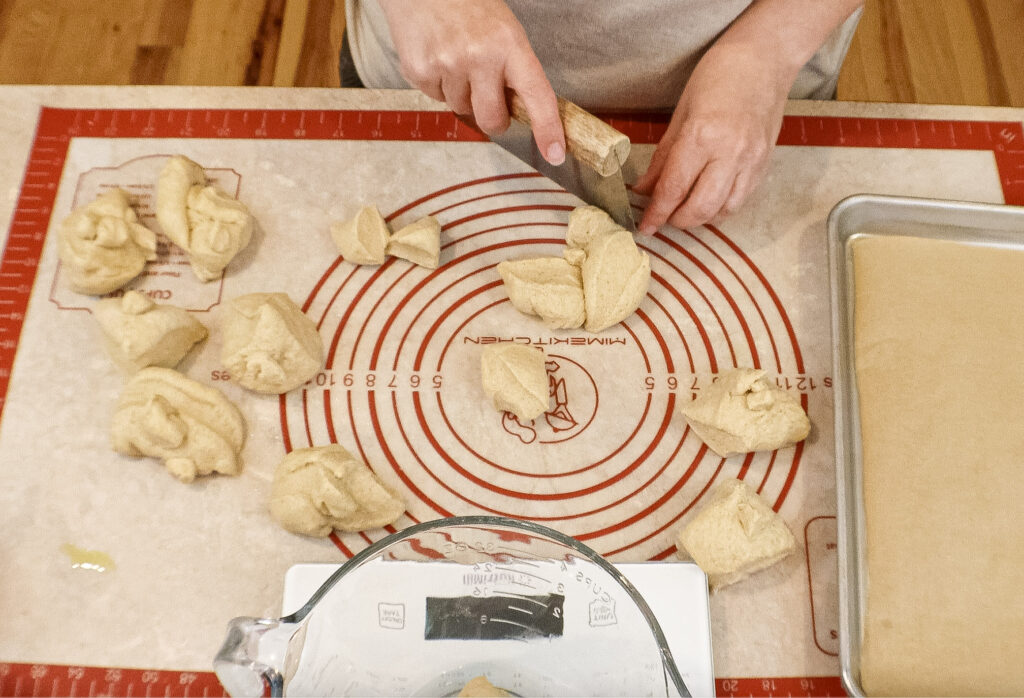 Dividing dough for garlic knots made with fresh milled flour.